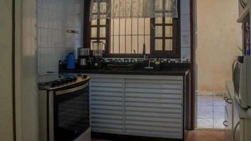 厨房, Piscina Aquecida, Ar Cond, Área Gourmet, Bilhar, Wi-Fi (Piscina Aquecida, Ar Cond, Area Gourmet, Bilhar, Wi-Fi) in 博皮兰加
