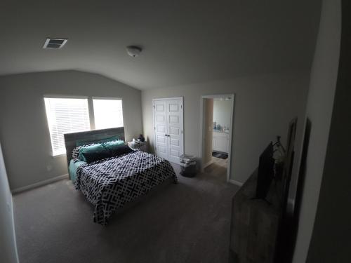 Charming Serenity Awaits The Zebra & Coffee Suites - Dual Queen Bedrooms with Exclusive Comforts, Open Quartz Kitchen, and Lush Patio Near Shopping Bliss in Locust Grove, USA