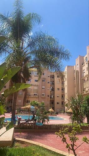 Appartement au rdc de la résidence Rosiers avec piscine à Monammedia