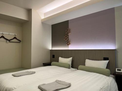 Bed, HOTEL JAPANESQUE KYOTO STATION ZEQUU in Kyoto