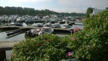 a marina filled with lots of boats on a sunny day, Eskolampi in Helsinki
