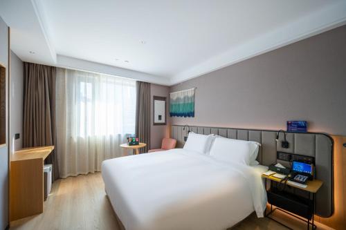 Deluxe Double Room room in True Go Hotel (Beijing Jianguomen Capital Children's Research Institute Store)