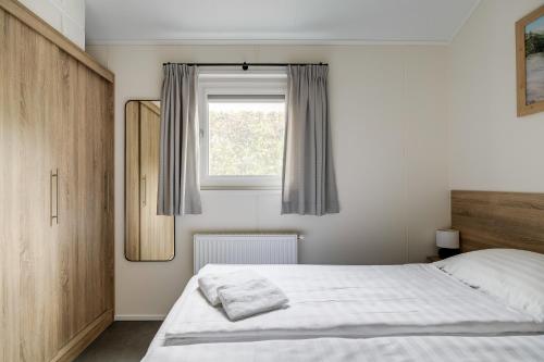 Modern ingericht chalet op groen park op de Veluwe Modern ingericht chalet op groen park op de Veluwe