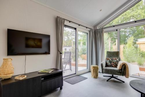 Modern ingericht chalet op groen park op de Veluwe Modern ingericht chalet op groen park op de Veluwe