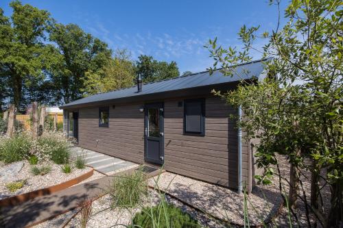 Modern ingericht chalet op groen park op de Veluwe Modern ingericht chalet op groen park op de Veluwe