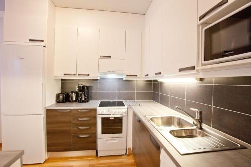 مطبخ, شقق كوتيمايلما روفانيمي (Kotimaailma Apartments Rovaniemi) in Rovaniemi City Center