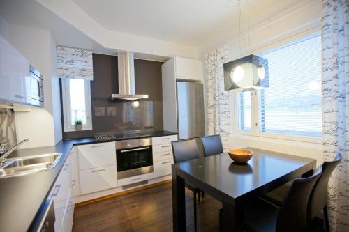 مطبخ, شقق كوتيمايلما روفانيمي (Kotimaailma Apartments Rovaniemi) in Rovaniemi City Center