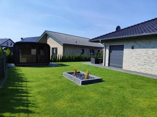 Ferienhaus Devilina mit Sauna und Kamin am Harkebrügger See in Barßel, Deutschland