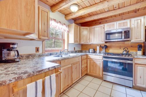 Interlochen Cabin with Fireplace - Near State Park! in Interlochen, USA