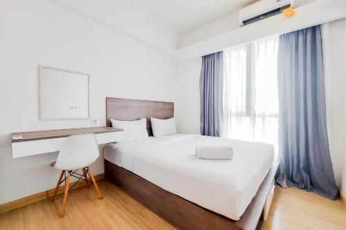 Comfortable and Homey Living 2BR at Sky House BSD Apartment By Travelio