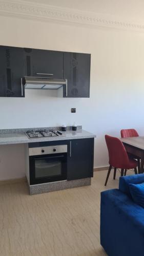 Appartement confortable avec vue sur la baie de Tanger et detroit de Gibraltar,situé en face de Mnar de Tanger ,Nouinouich, Residence avec piscine collective