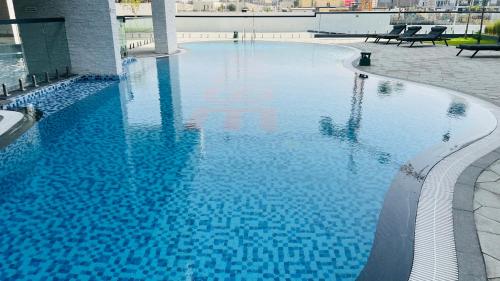 Swimming pool, Olivz Residence Furnished Cozy Studio Apartment in Dubai International City