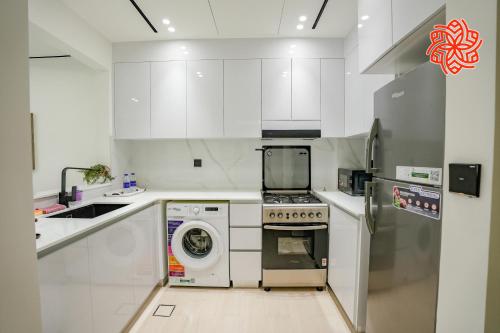 Kitchen, Alashrafia Saray - Bright 1bdr apartment in JVC in Jumeirah Village Circle