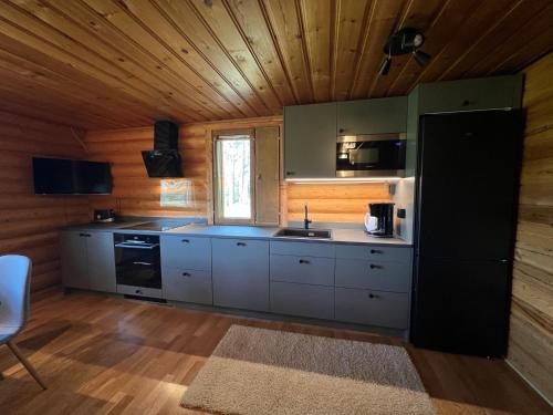 Logcabin, sauna, fireplace, view, kitchen in Yllasjarvi