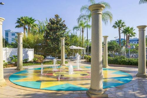 Enjoy your AM coffee in resort relaxation garden in this great 1BD condo in Orlando - image 9