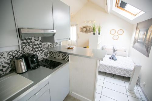 Cocina, L'Evasion - coeur de ville - WIFI - Gare in Les Mureaux