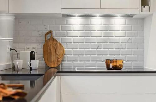 Triton luxe gelijkvloers appartement met tuin en gratis garage in 諾克-海斯特