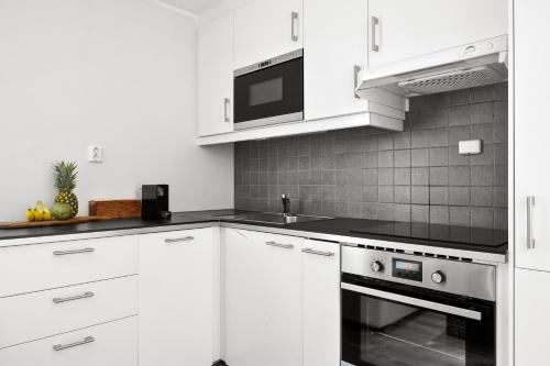 مطبخ, Pergola - Free parking - 5 min walk to facilities in Arstad