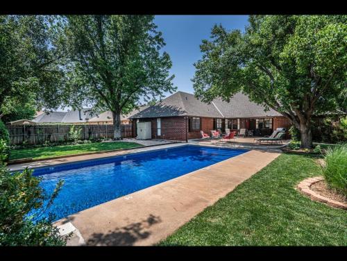 Spacious Retreat with Shaded Yard & Games home in Edmond, USA