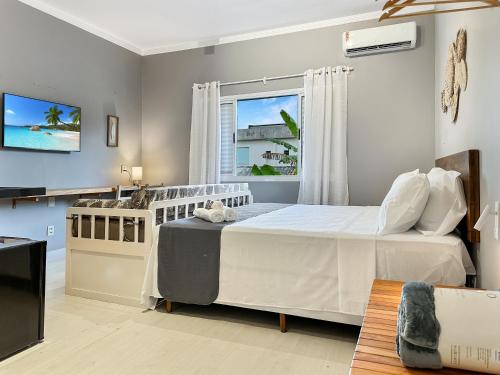 Maraka 26 Piscina AC 1 suíte 50m da Praia Churrasqueira (Maraka 26 Piscina AC 1 suite 50m da Praia Churrasqueira) in ตอร์ตูกา