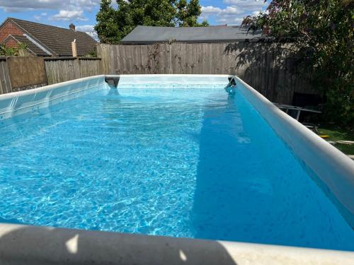 Skats, Lavender Lodge - Pool and Hot Tub with sunset views over open fields in Wicklewood