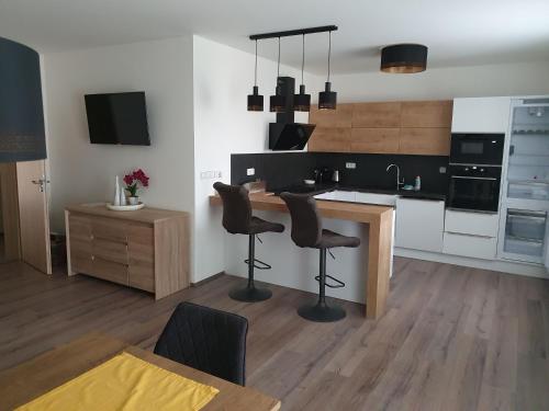Nový Apartmán v areálu Wellness hotelu Frymburk (Novy Apartman v arealu Wellness hotelu Frymburk) in ฟริมบูร์ก