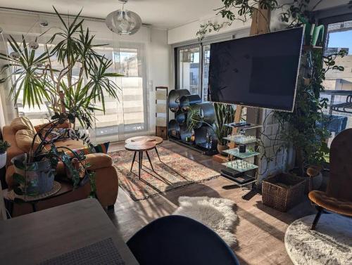 Logement 85m2, hypercentre, balcon, parking, clim