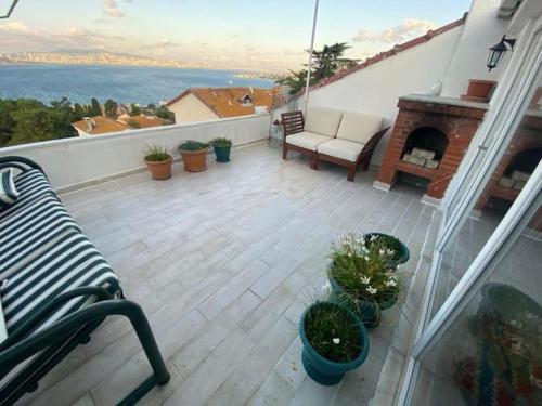 Panoramik deniz manzaralı dubleks in เฮย์เบเลียดา