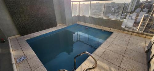 Swimming pool, Hermoso Homestudio en Nunez con Amplio balcon luminoso in Saavedra