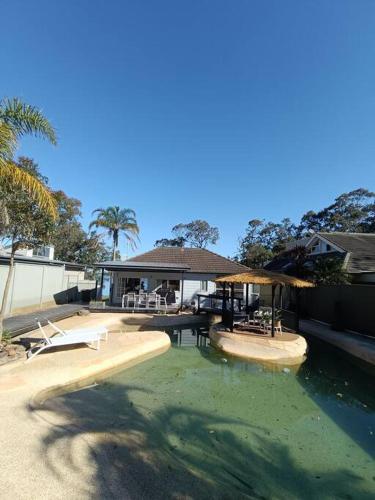 Waterfront Oasis Lakefront Villa with Pool and Sauna in Lake Munmorah