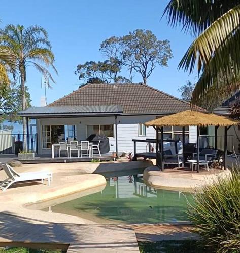 Waterfront Oasis Lakefront Villa with Pool and Sauna in Lake Munmorah