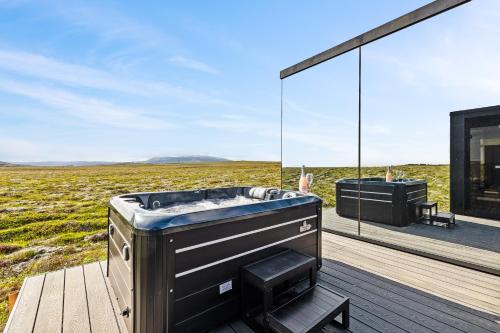 Hot tub, Heathland Lodge in Hveragerdi