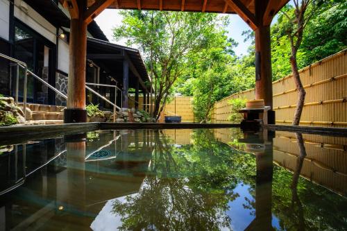 Yakushima Manten Ryokan — outdoor onsen bath