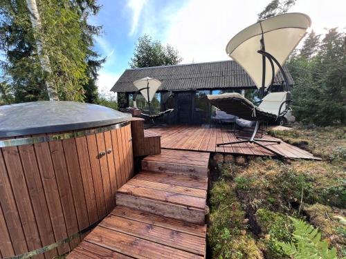 . Black house in the forest with Hot Tube and Home theater for movies