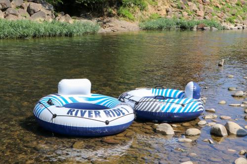 Wind down in this 2 Bed Oasis with River Access Hot Tub and Outdoor Fun Sleeps 6 Comfortably