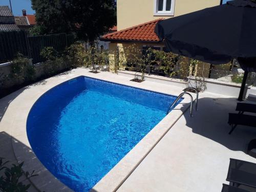 Ferienhaus mit Privatpool für 8 Personen ca 120 qm in Mugeba, Istrien Istrische Riviera - b54843