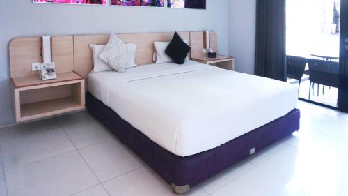 Conjioo Hotel Kuta Managed By MHM - Tap to explore photos