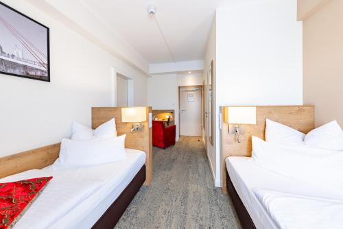 Twin Room room in Maingau Hotel