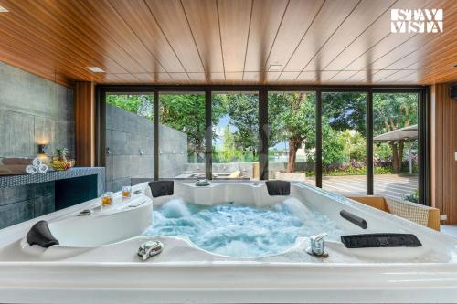 StayVista at Enclave of Bliss with Jacuzzi & BBQ Grill