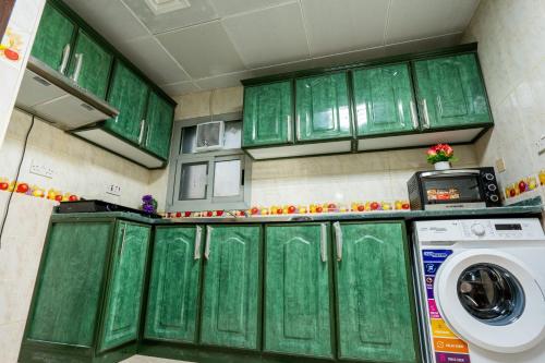 Kitchen, tourist Peaceful Family Rooms Abu Dhabi ME11APT baith al jannah LLC near Universal Speciality Medical Center