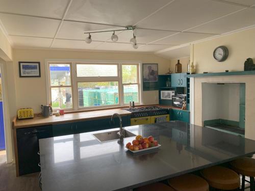 Large riverfront home with spa and stage in Te Kopuru