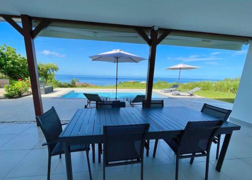 Balkons/terase, Magnifique villa 6 à 8 pers avec piscine - vue mer (Magnifique villa 6 a 8 pers avec piscine - vue mer) in Vieux-Habitants