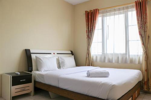 Elegant and Homey 2BR Puri Garden Apartment By Travelio