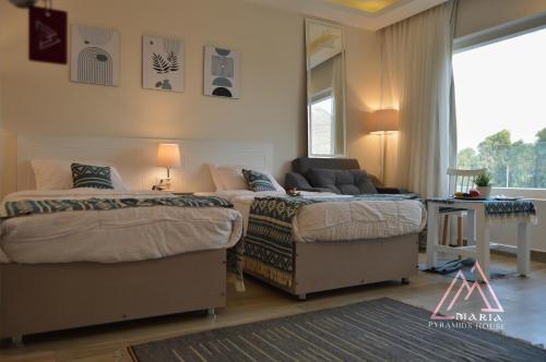 Maria Pyramids House