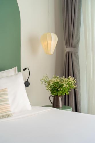 Deluxe Quadruple Room with Balcony room in Volar Hoi An