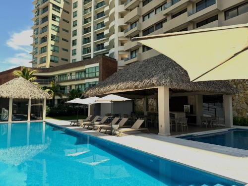 Departamento acogedor con vista al mar y alberca in Conchal, Mexico