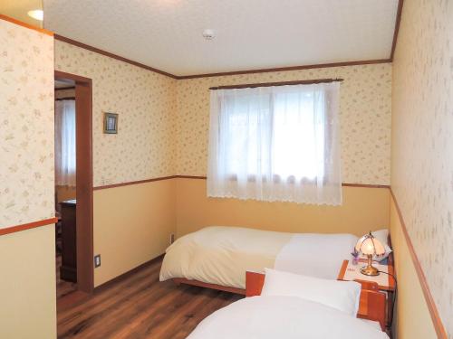 ペンションMoonLight Room Type - Triple Room with Shared Bathroom