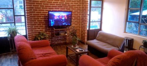Delt lounge/TV-område, La Otra Casita Feliz in Cochabamba