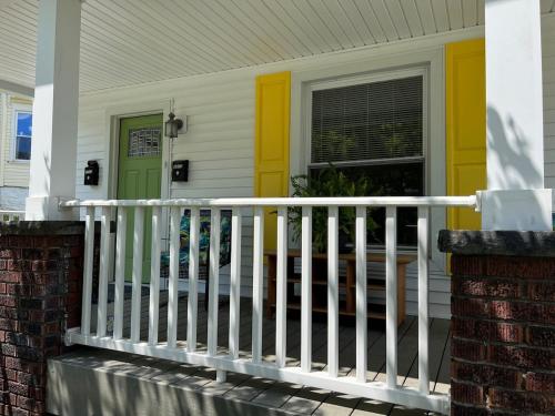 . Apt A The Yellow Shuttered House