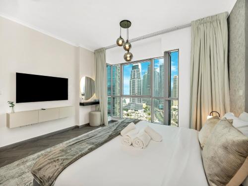 Luxe 4 bedroom Apartment I Burj Khalifa & Fountain Views I Free Gym, Pool, Parking, Wi-Fi and PS5 I by Skyline Serenity, Dubái (foto 7)
